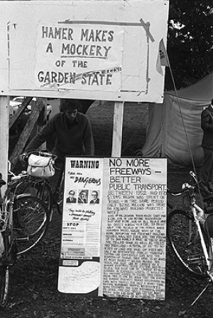 F19 freeway protest, 30th April 1977. Extended protests were held during the building of the F19 freeway (Alexandra Parade-Doncaster). Banner reads, Hamer makes a mockery of the garden state. 