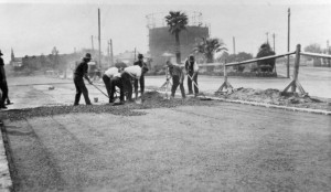 Workmen on the corner of Queens Pde and Alexandra Parade, The former Gasworks is visible in the background